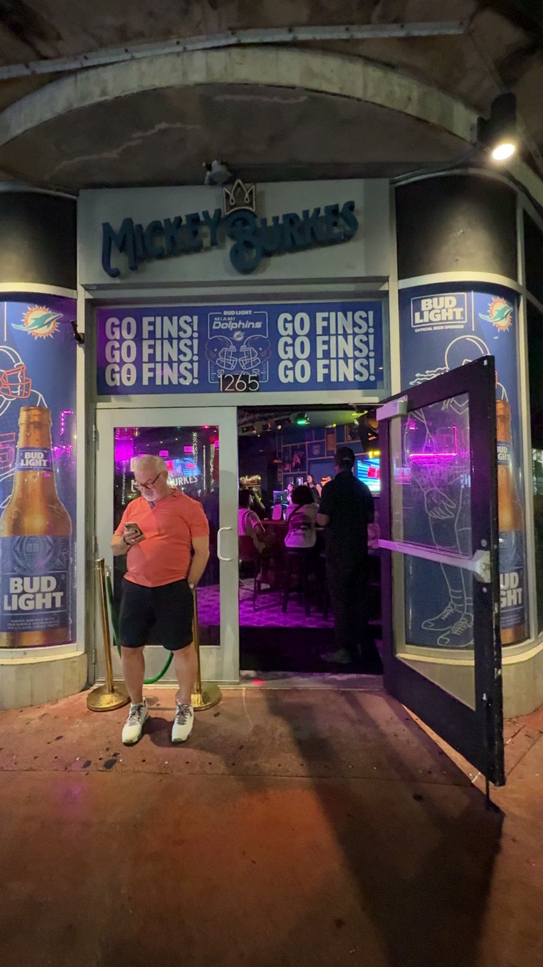 The front door of Mickey Burkes on Washington Avenue at night